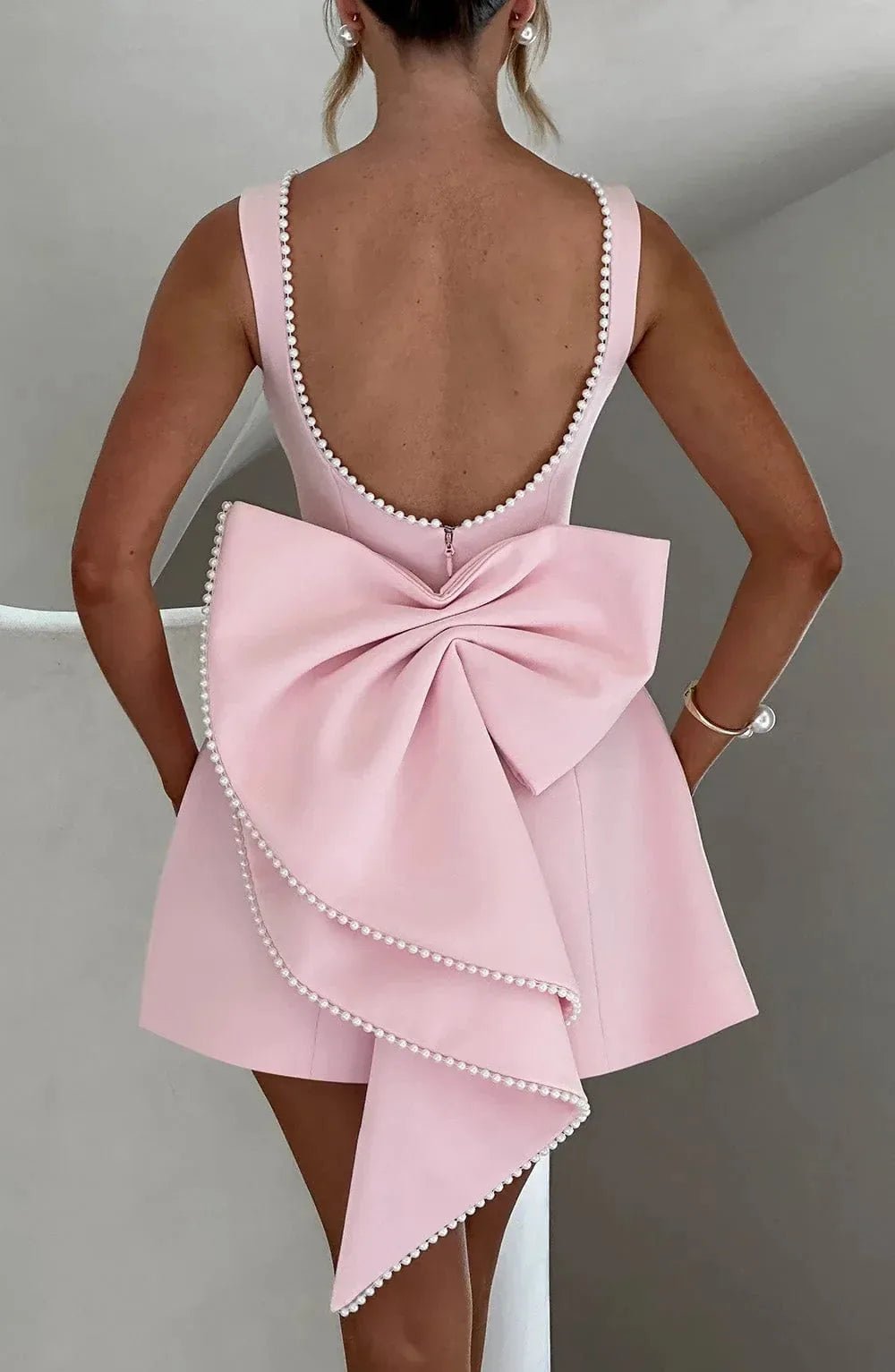 Ivy | Pearl Trim Backless Bow - Back Black Mini Dress - Emma's Dresses