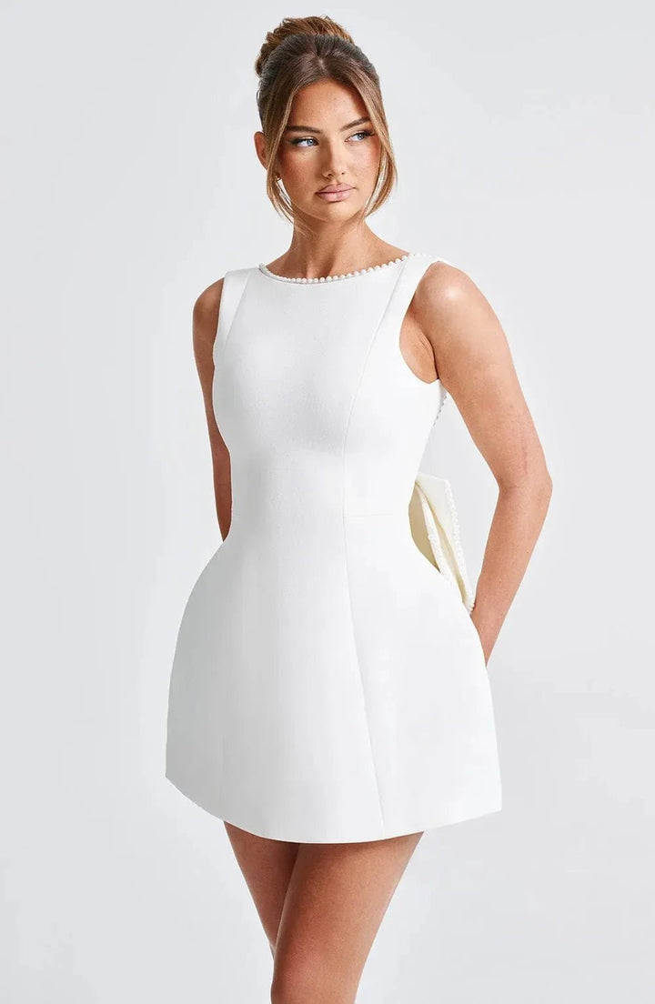 Ivy | Pearl Trim Backless Bow - Back Black Mini Dress - Emma's Dresses