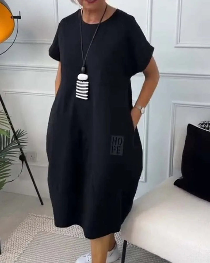 Elena | Effortless Short Sleeve Black Midi Dress With Pockets - Emma's Dresses