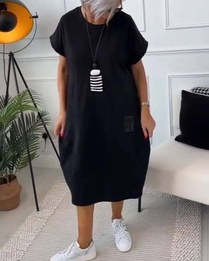 Elena | Effortless Short Sleeve Black Midi Dress With Pockets - Emma's Dresses