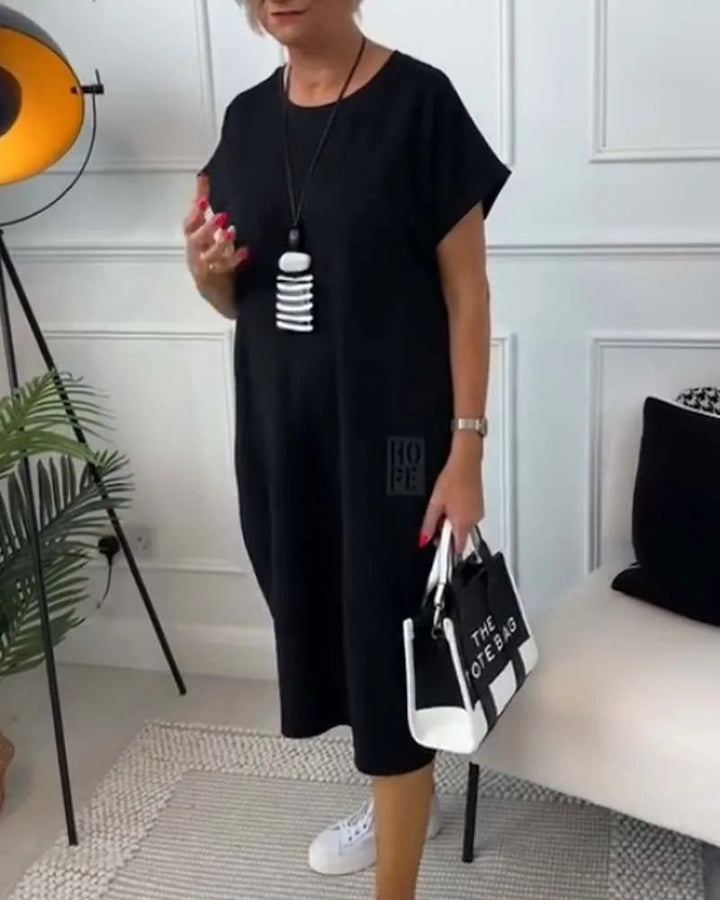 Elena | Effortless Short Sleeve Black Midi Dress With Pockets - Emma's Dresses