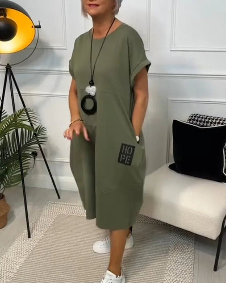 Elena | Effortless Short Sleeve Black Midi Dress With Pockets - Emma's Dresses